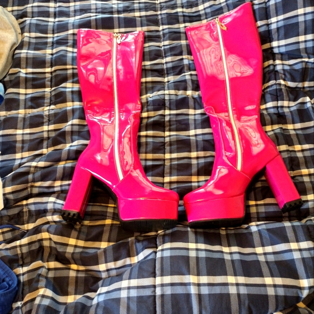 A pair of Red Rose knee high PVC/Rubber boots